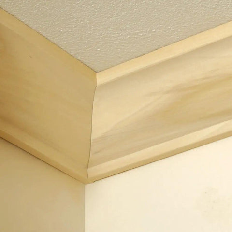 Corner view of crown molding installed with Speed Cope Crown Molding Jig With Adjustable Handle For DIY Woodworking, A Tough Crown Molding Tool For Clean Cope Cuts Up To Seven And A Quarter Inches Wide, 45 Degree And 90 Degree Inside Miters, Flat Miters, And More.