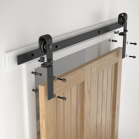 Beefy 3.5 Ft Bi Folding Sliding Barn Door Hardware Kit For Two Doors installed, showing black finish roller track and side mounts.