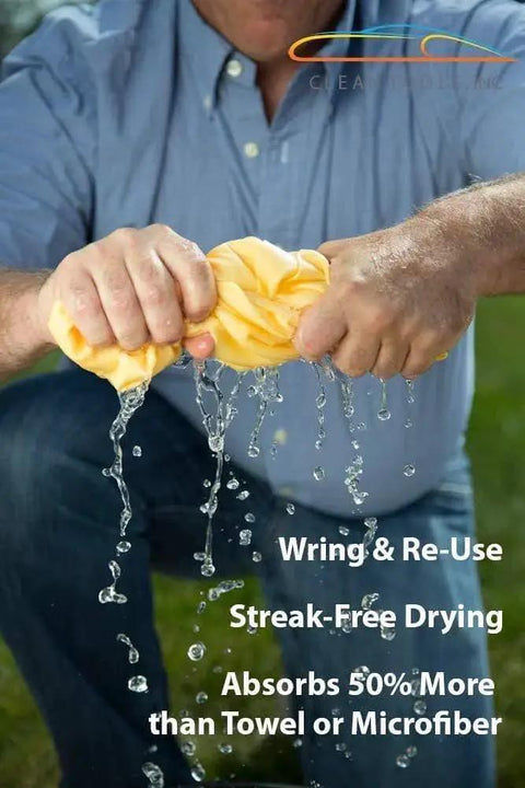Person wringing out Large 27x17 Inch Drying Chamois Cloth For Cars Super Absorbent Washable, showing high absorbency.
