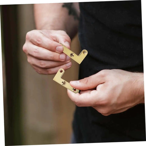 Person holding Rotatable Copper Pivot Door Hinges Set For Hidden Doors And Cabinets.