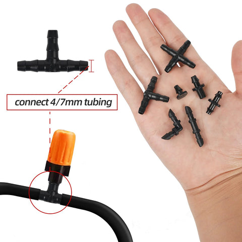 Barbed irrigation fittings kit for 1/4-in tubing; black plastic elbows, tees, cross (4-way) and end plugs.
