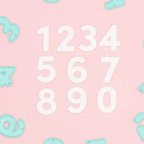 Number Shaped Die Cut Set, 0 Through 9, For Card Making And Scrapbooking, 10 Piece Die Cuts on pink background