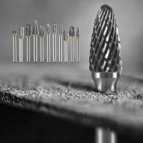 Double Cut Tungsten Carbide Burr Set For Metal And Wood Ten Piece With One Quarter Inch Shank Rotary Burrs In A Durable Round Case For Grinding Engraving Polishing Carving And Drilling HIDOTOL, close-up of burrs on surface
