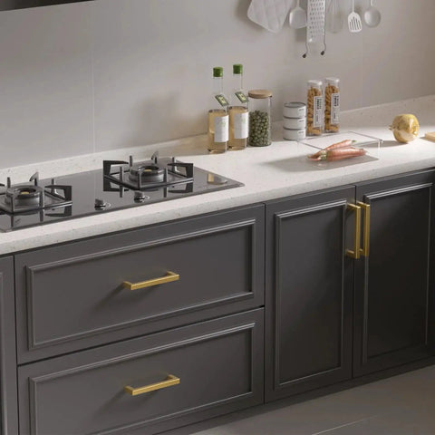 Kitchen with 30 Pack 5 Inch Gold Brushed Stainless Steel Cabinet Handles Square Bar Drawer Pulls installed on dark cabinets.