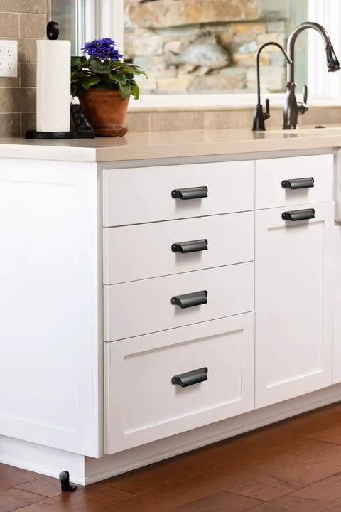 Installed white kitchen cabinets with Six Pack Black Cabinet Cup Pulls And Drawer Handles, zinc alloy, 128mm center distance.