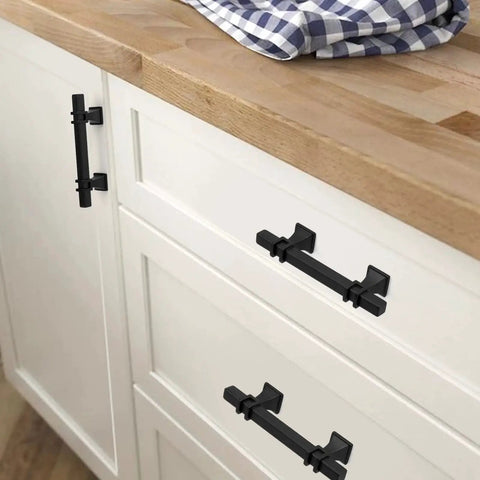 10 Pack 3 Inch Matte Black Cabinet Pulls With Solid Steel Construction And Zinc Alloy Base installed on white kitchen cabinets