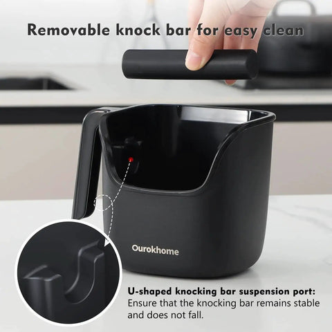 Black knock box for espresso grounds, pro-grade stainless steel barista tool with removable knock bar, handle and lid.