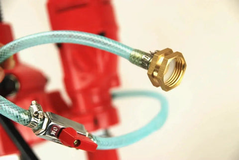 Close-up of hose connection on Heavy Duty Diamond Core Drill Bundle With Rolling Base Stand For Pros And 1 To 4 Inch Diamond Bit Set Dual Speed 2100 RPM And 950 RPM 110 Volt Concrete Coring BluRock Model 4Z1RB Package Deal.