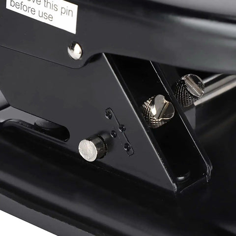 Close-up of heavy duty 4 hole paper punch showing iron construction and adjustment features for up to 30 sheets.