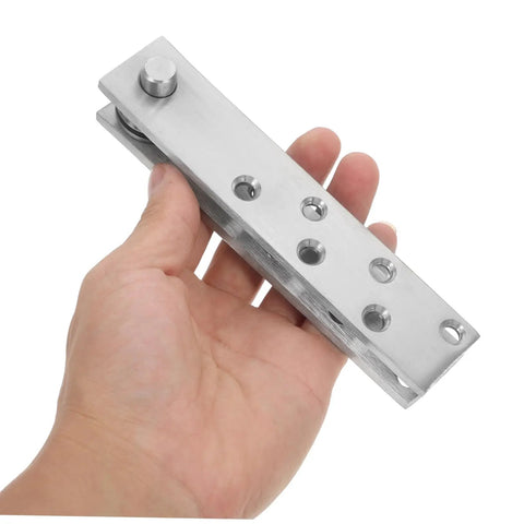 Hand holding a 360 Degree Stainless Steel Heavy Duty Pivot Hinge For Hidden Doors And Secret Bookcase Doors Concealed Hinges