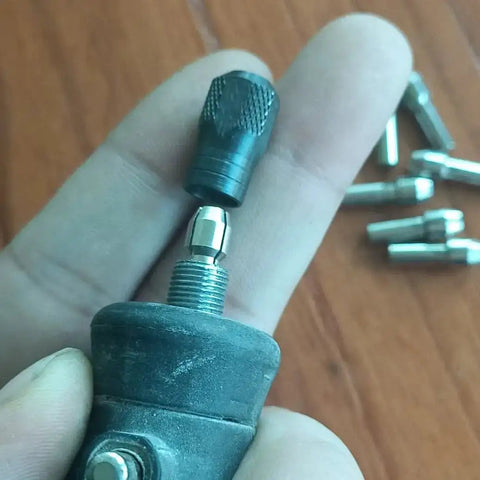 Close-up of Quick Change Rotary Collet Set With Clamping Nuts For Dremel Tools 9Pcs Stainless Steel Four Claw Holder being installed