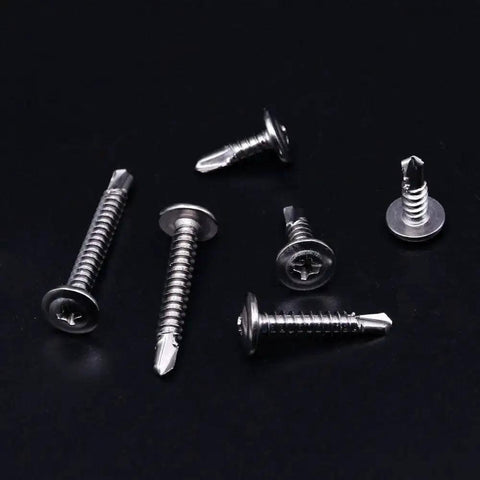 410 Stainless Steel Self Drilling Screws Kit For Metal With Wafer Head Phillips Drive Six Size Assortment scattered on black background