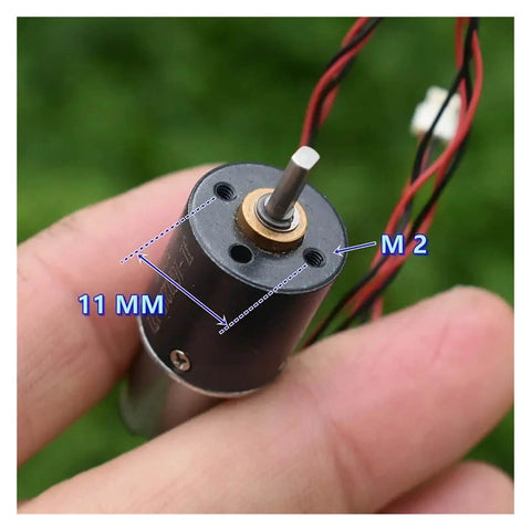 Close-up of 16mm Planetary Reduction Gearbox For DC Motors Electronic Starter in hand, showing shaft and wires, 11mm diameter.