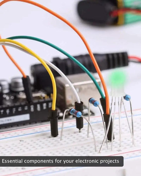 Resistor kit components on breadboard with assorted axial resistors and a green LED