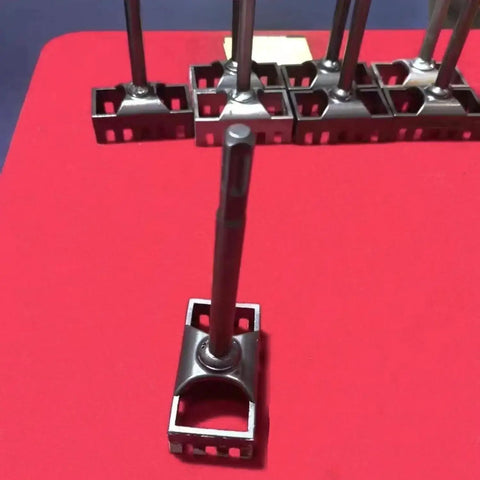 Square Hole Cutter Kit for 86-Type Electrical Junction Boxes on a red mat