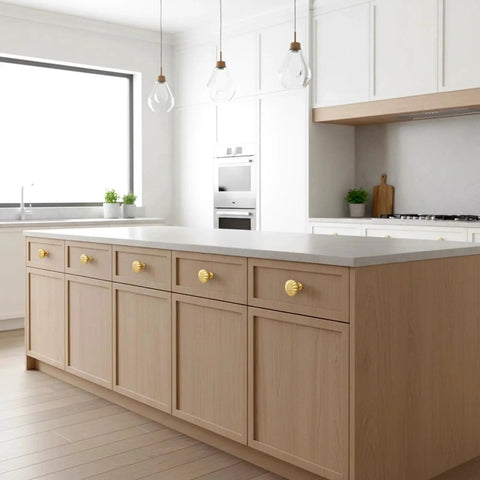 Modern kitchen with Six Pack Gold Cabinet Knobs With Brushed Brass Finish For Dresser And Drawer Doors installed on light wood cabinets.