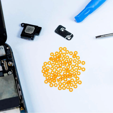 100 Pack Miniature Plastic Bushings and Axle Sleeves for Toy Vehicles with orange sleeves on a white background.