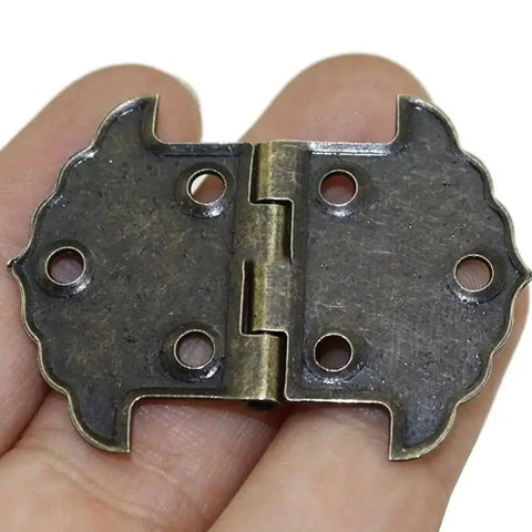 Lace Iron Hinge For Cabinets And Furniture, Heavy Duty Metal Hinge With Square Link Buckle, shown in hand for size reference