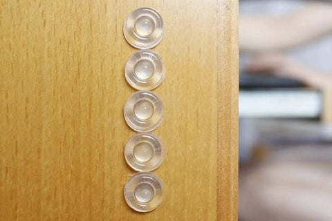 Sound Dampening Door Bumpers Half Inch Dia 5mm Height Soft Durometer installed on wood surface