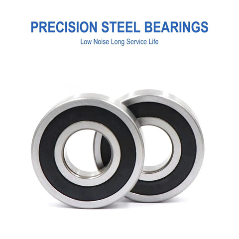 Close-up of two precision steel bearings with black inner rings.