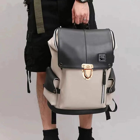 Person holding a beige and black backpack with a gold twist lock clasp, suitable for DIY handbag projects and secure bag closures.