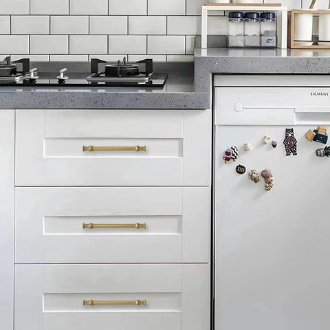 Champagne Bronze Cabinet Pulls in 5 Inch Hole Center for Cupboard and Drawer installed on white kitchen cabinets.