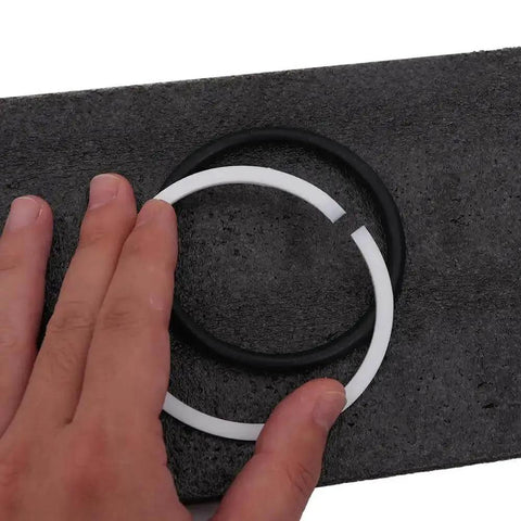 Close-up of free CH70 oil seal and pre-cut white O-ring included in 6 Piece Hydraulic Round Die Set For CH70 Punching Machine
