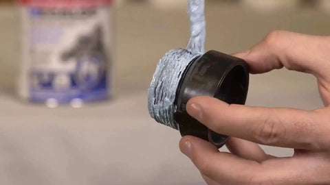 Applying Megaloc Multi-Purpose Thread Sealant For Pipes And Fittings, Blue Liquid Paste, 16 Oz Can on a plastic pipe thread