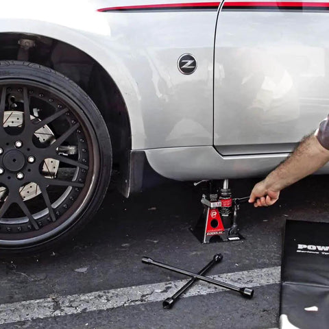 3 Ton Bottle Jack And Jack Stands In One Car Lift For SUVs And Trucks Heavy Duty Unijack under a parked car with safety bar engaged