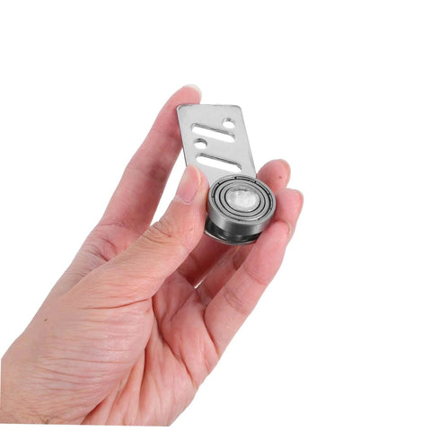Close-up of hand holding Beefy Stainless Steel Sliding Door Pulley Kit With Track Mounted Roller For Smooth Movement And Low Maintenance