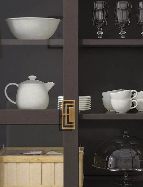 4 Pieces 3.93 Inch Gold Zinc Alloy Cabinet Handles With Hollow Geometric Design installed on a dark cabinet door