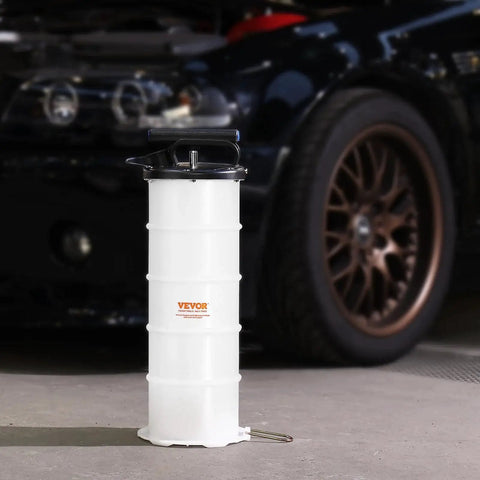 6.5L Manual Oil Change Fluid Extractor Pump With Dipstick And Suction Hose in front of a car
