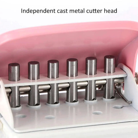 Close-up of the pink handheld six-hole punch with metal cutter heads for loose-leaf paper A4 A5 B5, showing precise alignment posts.