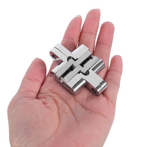 Hand holding Hidden 43mm Zinc Alloy Concealed Hinges Set For Jewelry Boxes And Cabinet Doors With 180 Degree Folding Cross Hinges Black Mini Hinge Kit