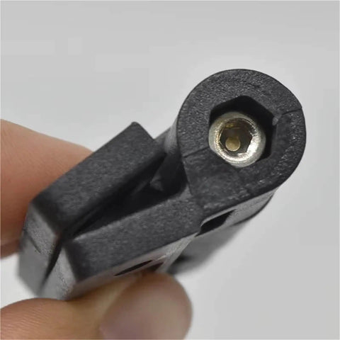 Close-up of 2 Pack Adjustable Torque Plastic Hinges Black Positioning Door Hinges 72x56x19mm held in hand, showing screw adjustment.
