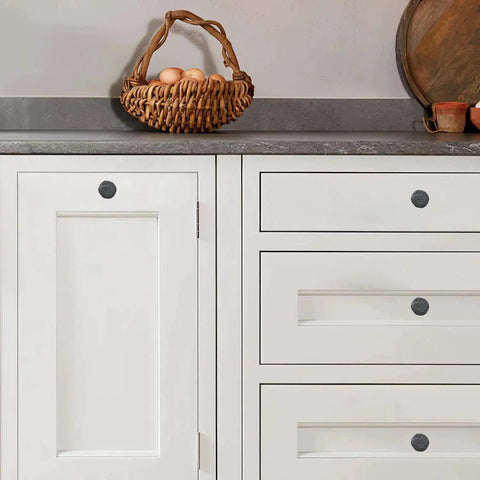 Set of 10 Rustic 1-1/2 Inch Black Iron Cabinet Knobs, installed on white kitchen cabinets, showing vintage farmhouse style
