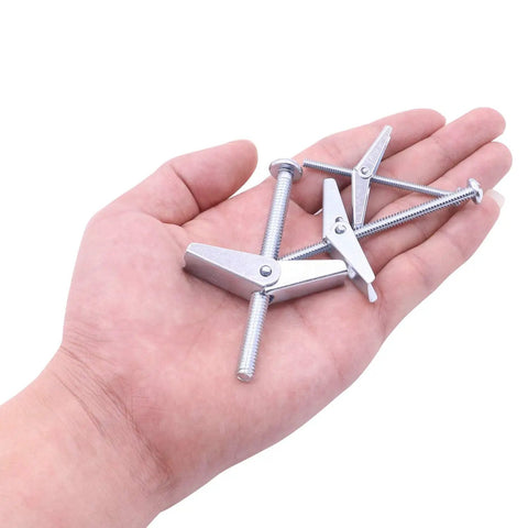 Hand holding 10 Pack One Quarter Inch Toggle Anchors for Drywall with Zinc Plated Steel Bolts Screws and Anchors Heavy Duty Wall Mounts