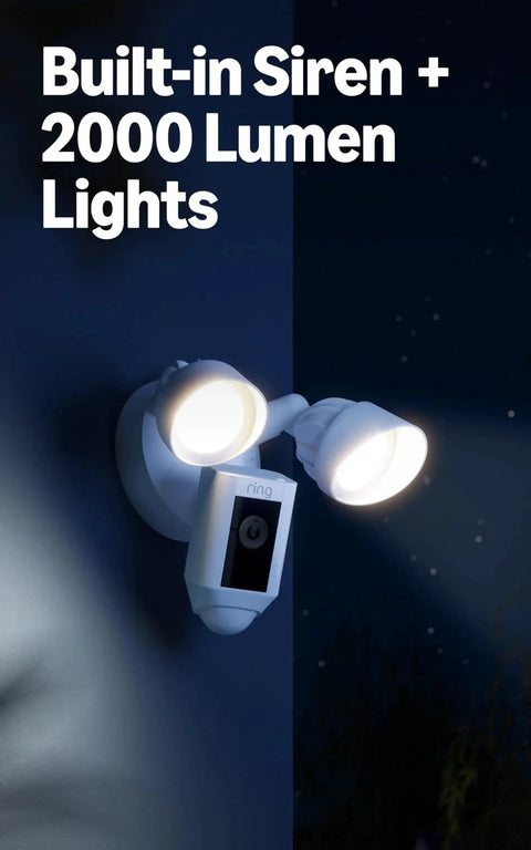 Floodlight Cam Wired Plus Outdoor Security Camera With 1080p HD And Motion Zones installed on house wall at night.