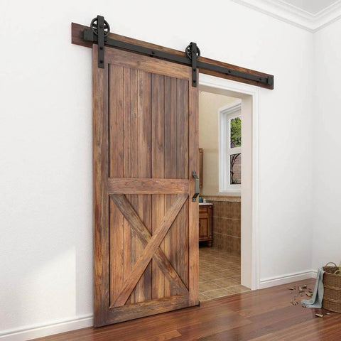 Heavy Duty Boss Grade Black Barn Door Hardware Kit For Wood Sliding Doors Five To Sixteen Feet Flat Track System With Big Spoke Wheel Rollers Carbon Steel Build Dual 3.75 Foot Tracks Ideal For Closet Or Garage Use installed on wooden door