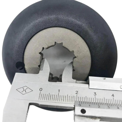 Clutch for Cam Helix, black rubber outer with silver metal hub, approx 40 mm diameter.