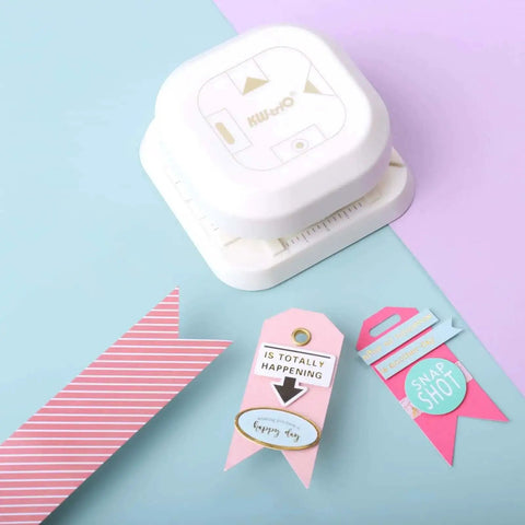 4 In 1 Paper Corner Trimmer With Oval Fish Eye Dovetail And Diagonal Angle Puncher on colored paper background with tags