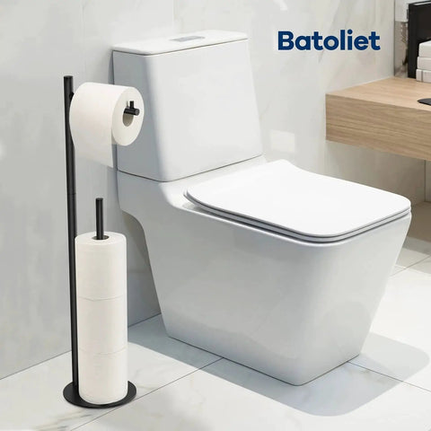 Free Standing Black Toilet Paper Holder Stand With Reserve Storage Space Saving Bathroom Roll Holder next to white toilet