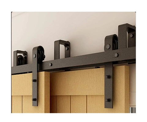 Close-up of installed Bypass Sliding Barn Door Hardware Kit For Double Doors With J Shaped Rollers on wood door