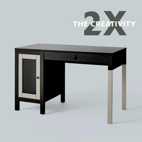 Modern black desk with one drawer and side cabinet featuring a minimalist design against a plain background, text '2X The Creativity' displayed.