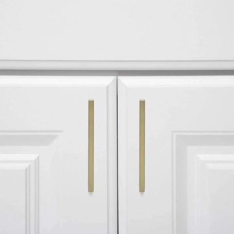 Modern Square Cabinet Pull Handle With Golden Champagne Finish, 5.39-Inch Length, 5-Inch Hole Center, installed on white cabinet doors