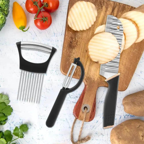 3-piece Black Crinkle Cutter set with onion holder and peeler on kitchen counter, ideal for potatoes, onions, carrots, cucumbers.
