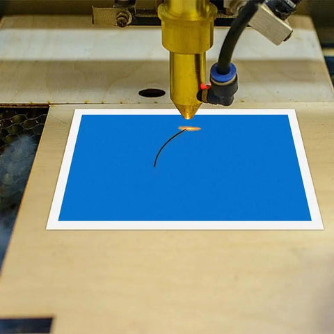 Laser engraving on blue sheet from 12 Color Laser Engraving Marking Paper Set With Scraper For Fiber Marking And Engraving On Metal Ceramics And Glass