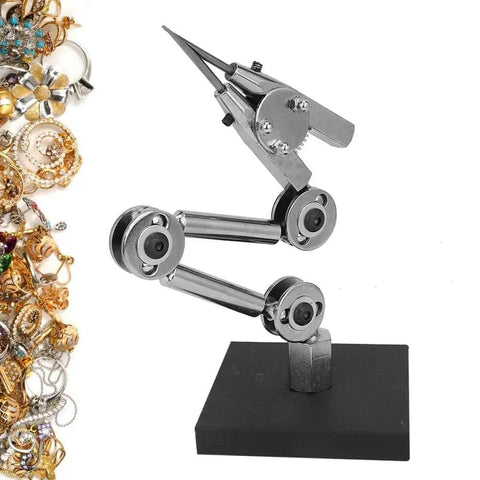 Heavy Duty Jewelry Welding Fixture Table Clip Clamp For Soldering And Repairing with jewelry pieces on a black base.