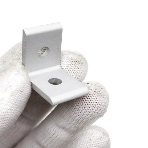 Close-up of corner bracket from 10 Set 1010 Series 1 Inch By 1 Inch Aluminium Extrusion Corner Bracket Connector Kit held by gloved hand.