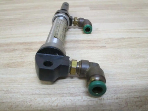 Front view of Industrial Hydraulic Cylinder 10mm Bore With Two And One Half Inches Stroke PN 13316050001 on a wooden surface.